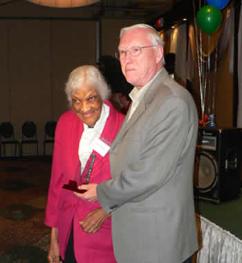 20 year volunteer and centenarian, Stella George with Larry Burke, Executive Director, St. Paul�s L�Amoreaux Centre.