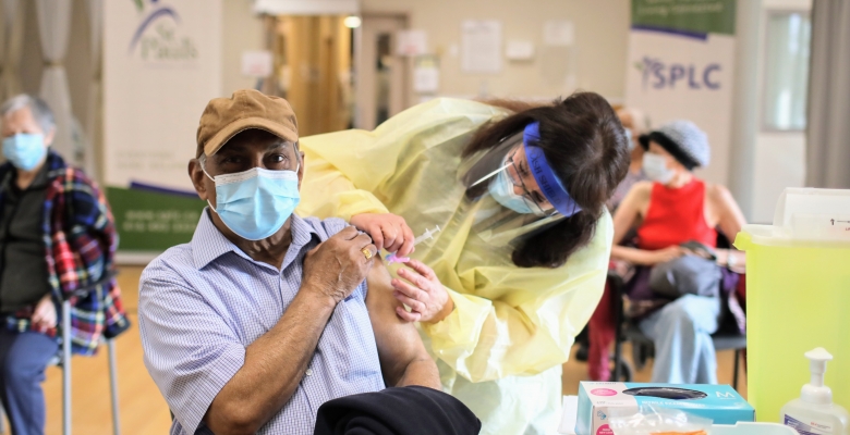 Man getting his vaccination Man getting his vaccination